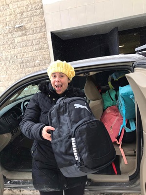 7 - Anna Morgante distributing backpacks